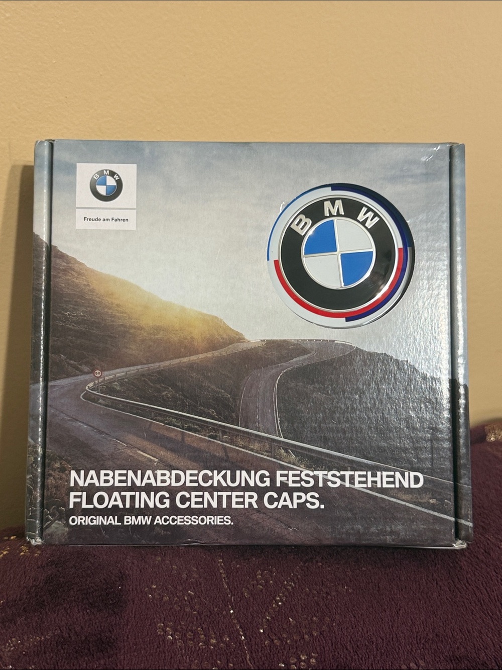 Floating BMW Center Cap Emblem in Blue, White, Black with Red Accent